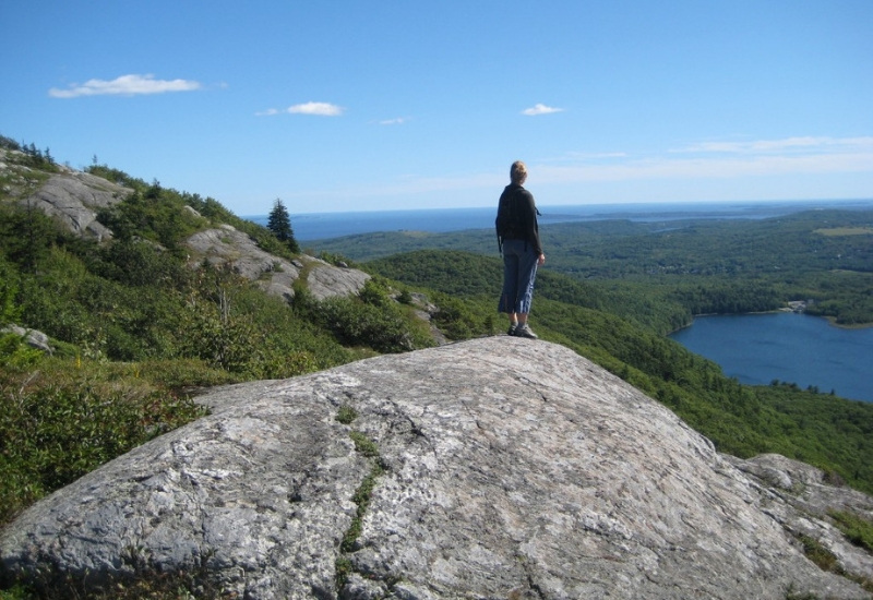 hiker looking over camden and rockport penobscot bay